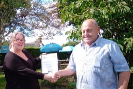 The Tom Cobley Tavern’s Lucy Cudlip being presented with both the Exeter and East Devon and South West Region CAMRA Cider Pub of the Year Awards by Regional Cider Co-ordinator Bob Southwell on September 2.
