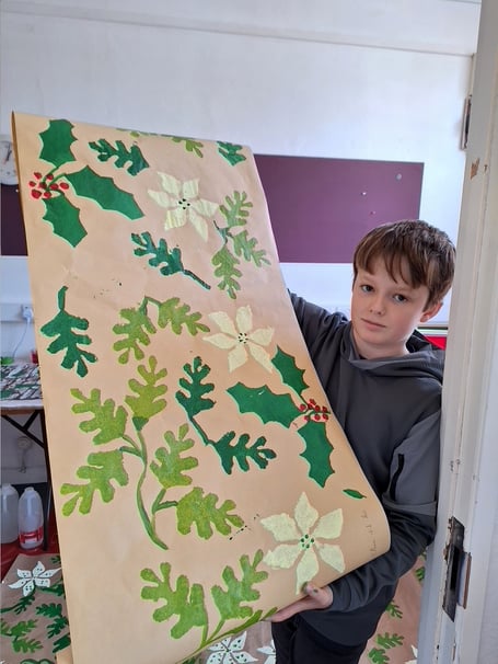 Ethan with his Christmas wrapping paper.
