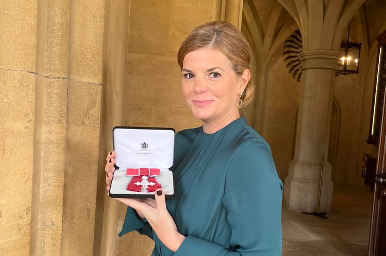 Julia Adamson - with MBE.