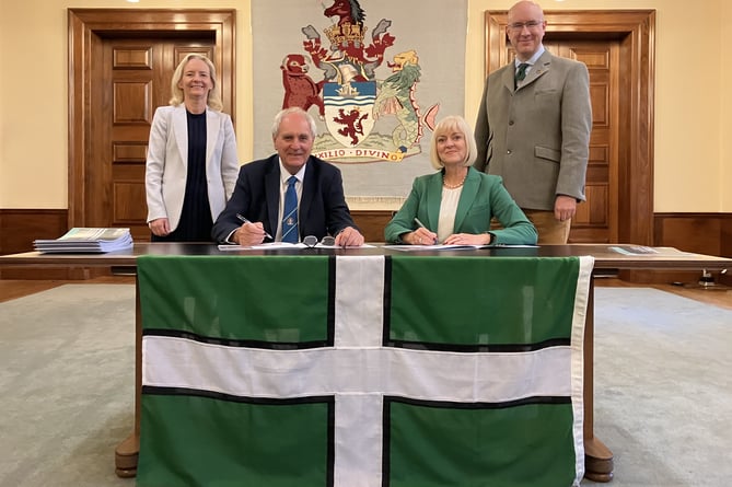At the signing of the agreement, Donna Manson (Devon County Council Chief Executive), Councillor John Hart (Devon County Council Leader), Professor Lisa Roberts (President and Vice Chancellor at the University of Exeter) and Stuart Brocklehurst (University of Exeter Deputy Vice Chancellor for Business Engagement and Innovation).