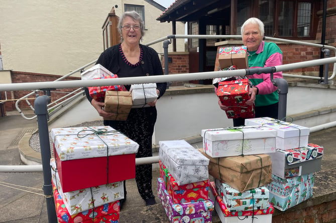With some of the filled shoeboxes from Crediton Methodist Church.  AQ 9240