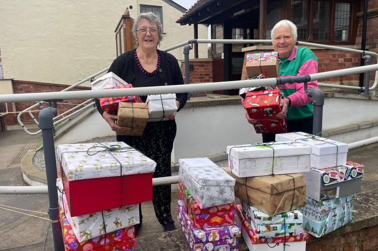 With some of the filled shoeboxes from Crediton Methodist Church.  AQ 9240