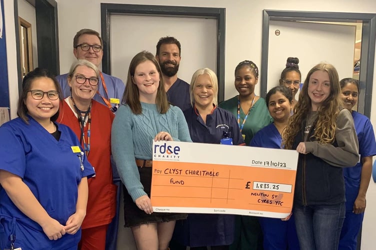 Newton St Cyres YFC members presenting the cheque to the Exeter Stroke Unit.