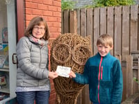 Percy names the willow owl “Hoot” at Crediton Library

