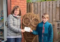Percy names the willow owl “Hoot” at Crediton Library
