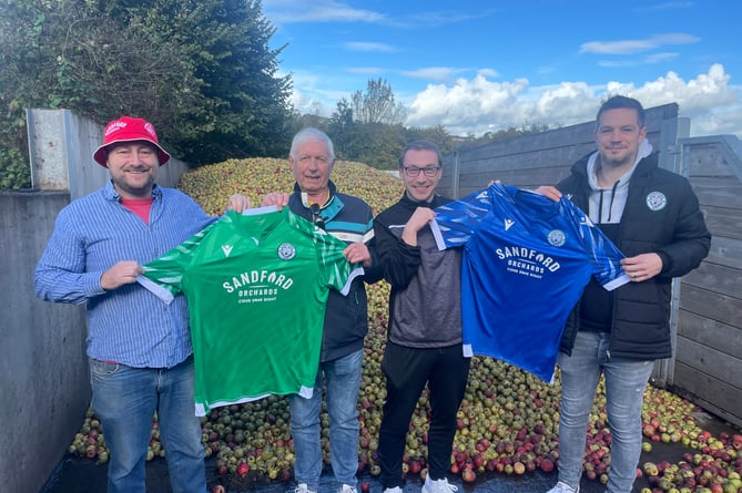 Barny Butterfield, Chief Cidermaker at Sandford Orchards, left, with the new shirts for Sandford AFC teams with, from second left, club member Alec Hill, chairman Adam Voisey and First Team manager Ben Waller.  AQ 9399
