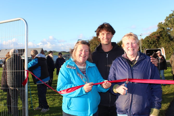 Left to right, Jo Morgan, Kye Forte, Caroline Taylor with the scissors.  SR 9151 
