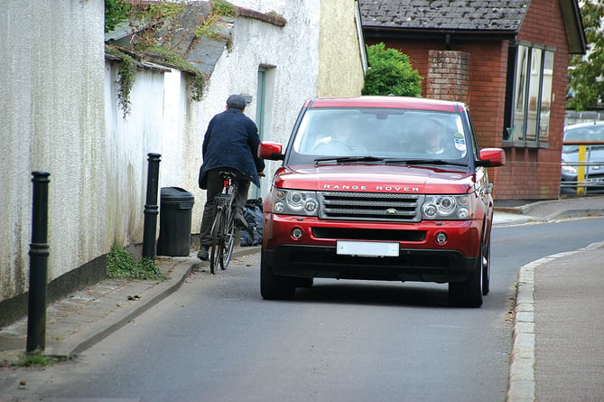A cyclist travelling the wrong way in the one-way section of Belle Parade in Crediton.  AQ 4309