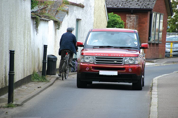 A cyclist travelling the wrong way in the one-way section of Belle Parade in Crediton. AQ 4309