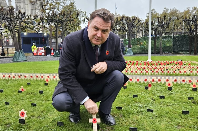 Mel Stride MP planting a cross in the Garden of Remembrance in Parliament to remember and honour fallen local heroes.