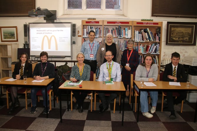 The students, judges and adjudicators for the debate about McDonald’s which took place in the Library at Queen Elizabeth’s School.  AQ 2760
