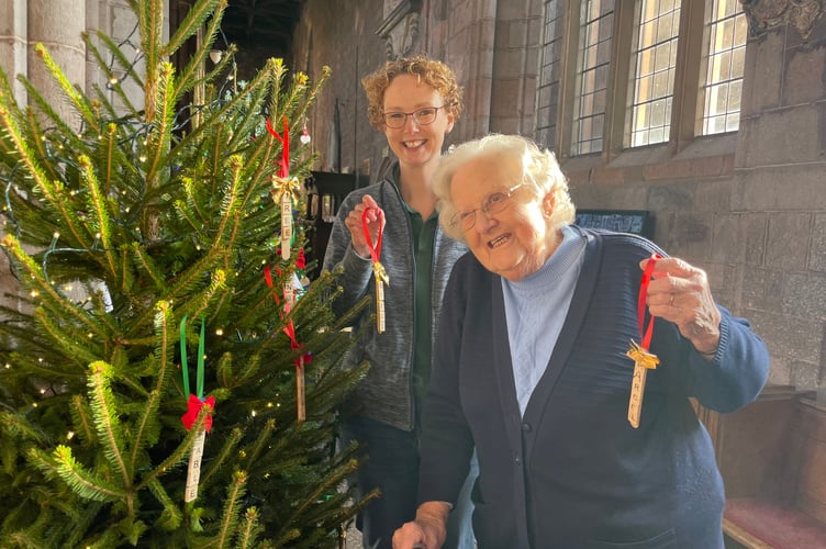 Decorating a tree at last year’s Christmas Tree Festival in Crediton Parish Church.