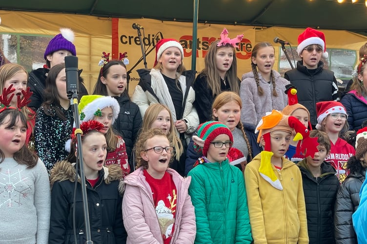 Children singing at Christmas in Crediton Lights Switch-On.
AQ 0863