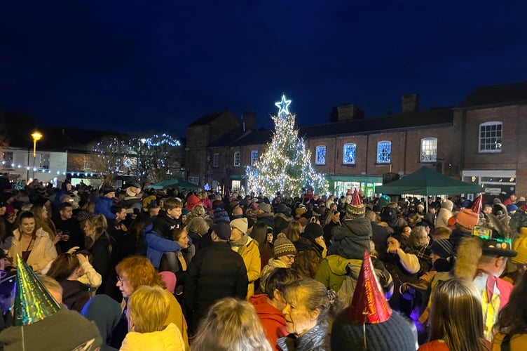 A packed town square and the giant Christmas tree.  AQ 0946
