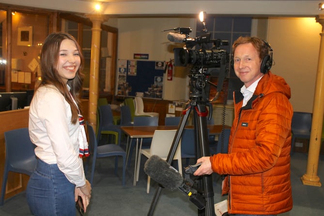 Refugee Olena Mevsha being interviewed by John Danks from the BBC in Crediton last week.  AQ 0120
