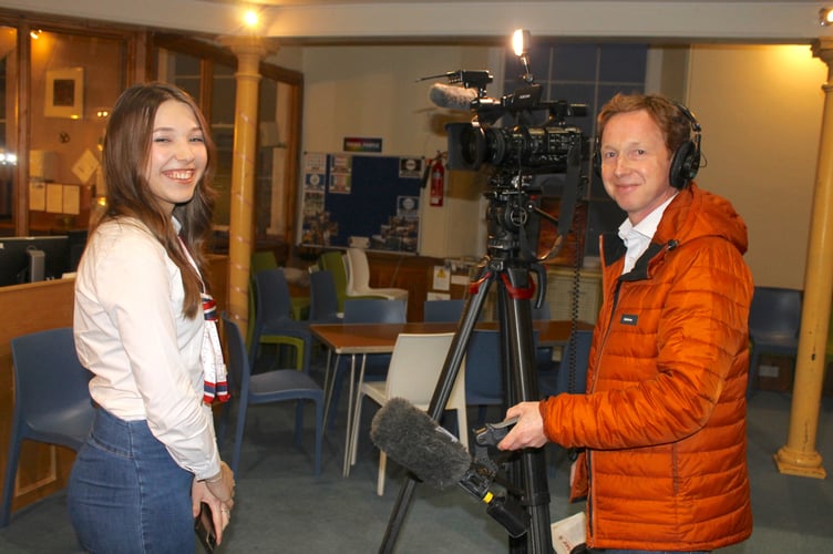 Refugee Olena Mevsha being interviewed by John Danks from the BBC in Crediton last week. AQ 0120