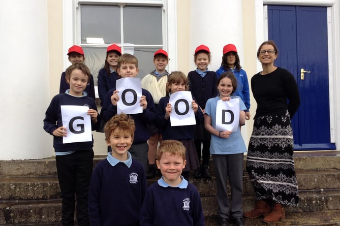 Hannah Fee, Head of Sandford School, with members of the school council and play leaders celebrating the school's recent 'Good' Ofsted grading.
