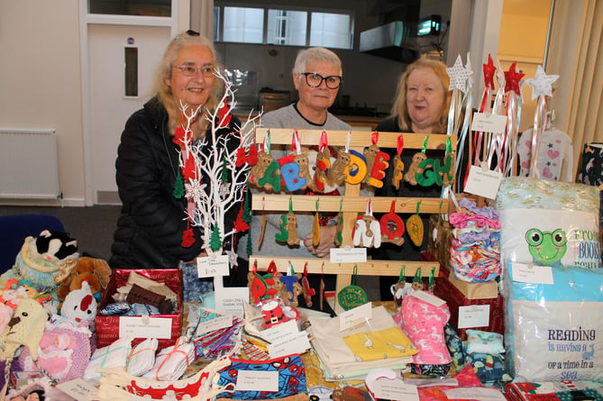 Three friends, Christine Wills, Alice Deaton and Sue Stevens had a stall selling their knitted and crochet items and sewn and machine embroidery items.  AQ 0030
