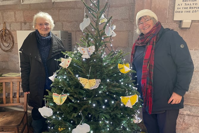 Decorating the Kenwyn Home tree in Crediton Parish Church for the Christmas Tree Festival this week.  AQ 1434
