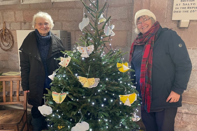 Decorating the Kenwyn Home tree in Crediton Parish Church for the Christmas Tree Festival this week.  AQ 1434