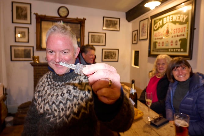 Toby Rubbra holding the key to The Drewe Arms.