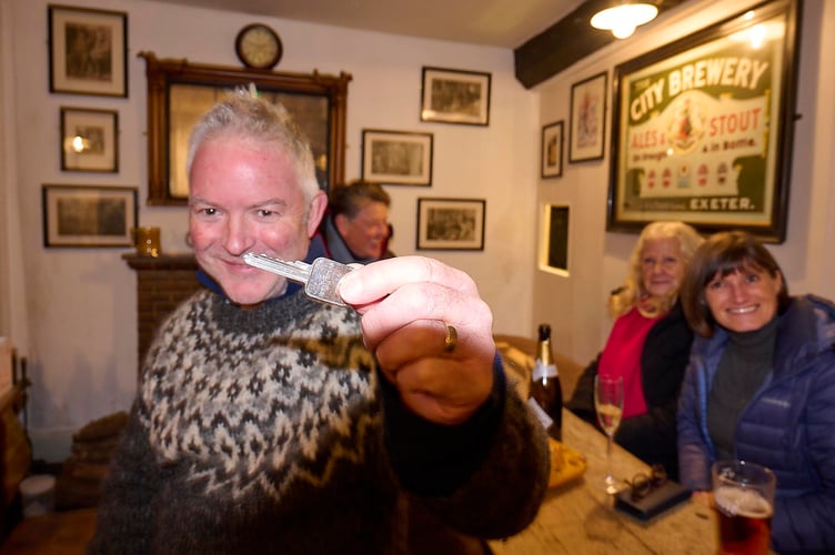 Toby Rubbra holding the key to The Drewe Arms.