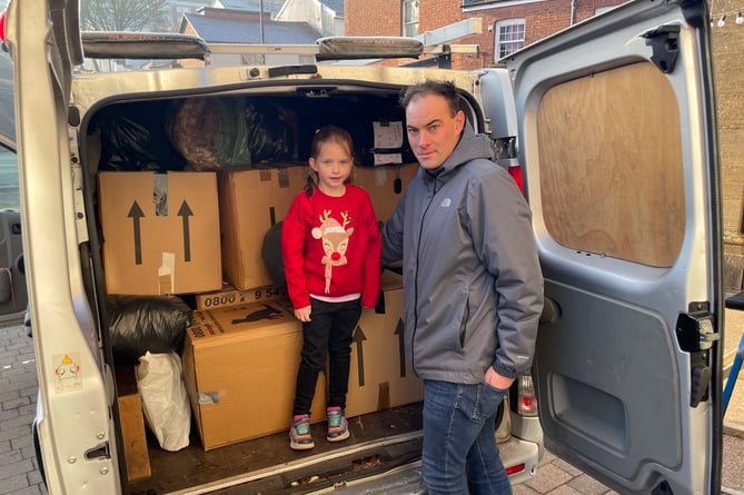 Joel from Projexe Engineering and his daughter Ella who packed a van and drove the items to Refugee Aid in Taunton.  AQ 1244
