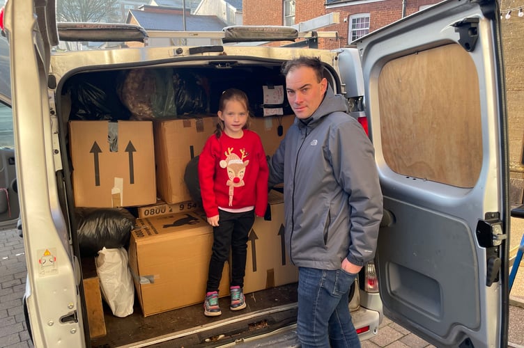 Joel from Projexe Engineering and his daughter Ella who packed a van and drove the items to Refugee Aid in Taunton. AQ 1244