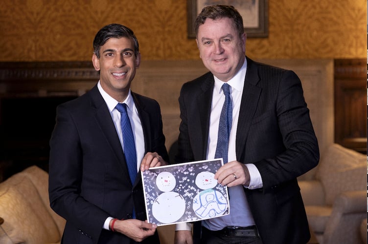 Prime Minister Rishi Sunak and Central Devon MP Mel Stride with Ellis's Christmas Card design.