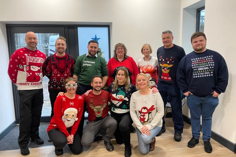 The staff from Crediton Dairy who wore Christmas jumpers to support the charity, Save the Children.  AQ 1551