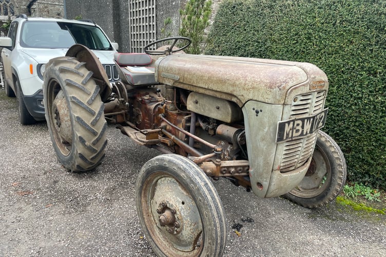A 1957 Massey Ferguson tractor was parked outside Coldridge Parish Church for Michael Thorne’s Thanskgiving Service.  AQ 0619