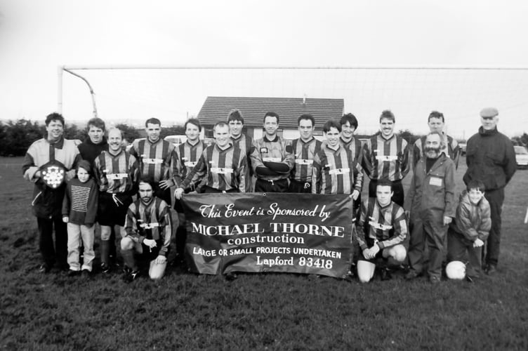 Michael Thorne, fourth right, of Michael Thorne Construction, when he sponsored a new strip for Lapford Football Club in December 1994.  DSC01228