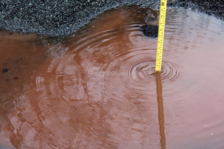 Measuring the depth at one-and-a-half inches at one spot but it feels more because the grit has banked up creating more of a crater. SR 9283