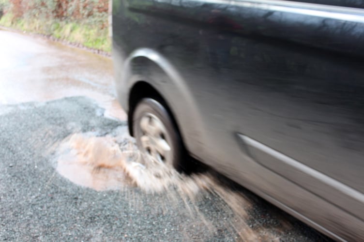 A car splashes through. SR 9281