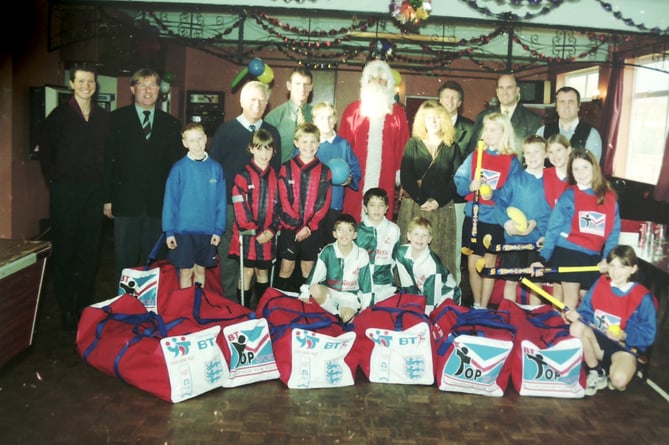 Martin Harrison, MDDC sports development officer dressed at Santa to present sports bags to pupils from local primary schools in December 1998.  DSC01647
