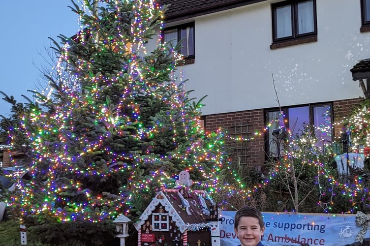 Austin beside the 24ft Christmas tree.