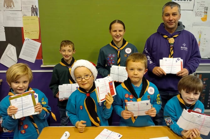 Some of the 1st Crediton Scout Group’s young members collecting bundles of Christmas Post.
