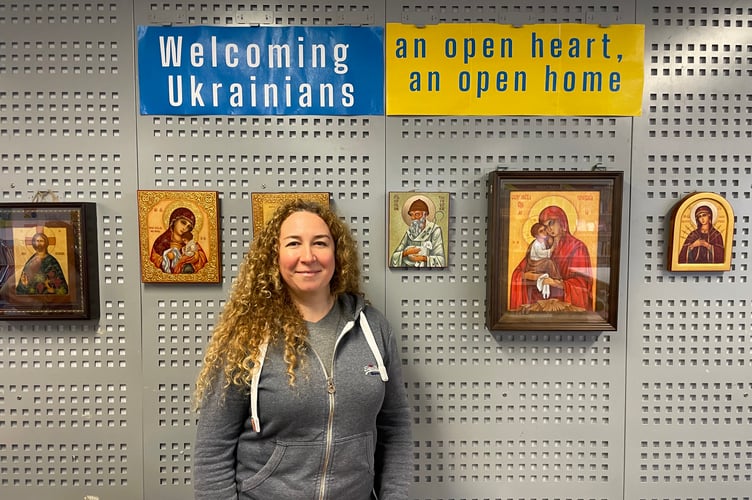 Anna Mazur beside some of her icons on display at Crediton Library. AQ 2260
