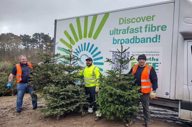Jurasssic volunteers helping with the Christmas tree collection last year.
