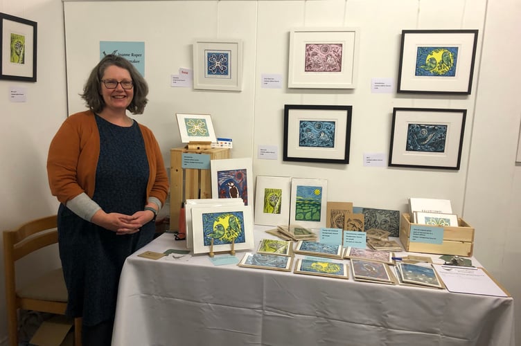 Jo Roper with examples of her printmaking.