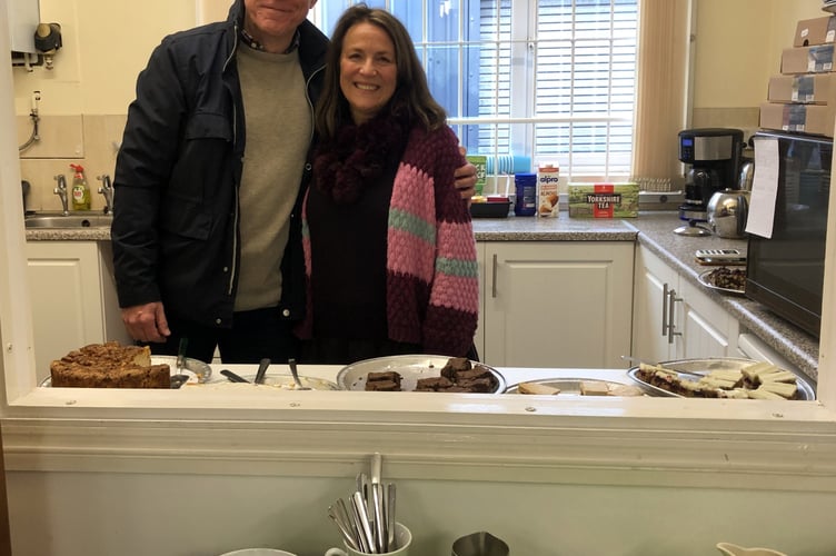 Philip and Jo Cunningham helping in the kitchen.