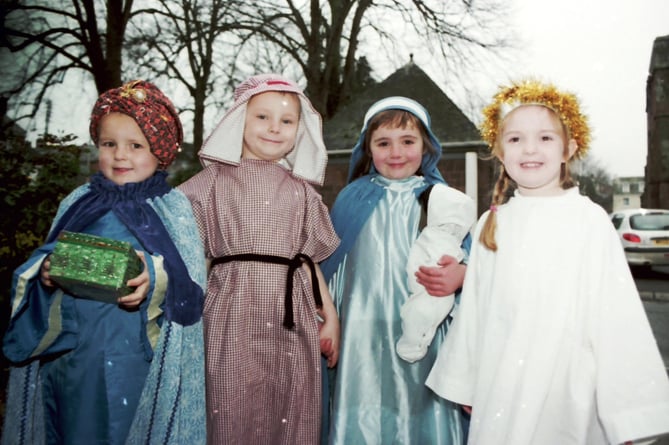 Four children who took part in Hayward's School's Christmas Tableaux in December 2002.  DSC00521  Photos can be purchased from the “Crediton Courier” office.
