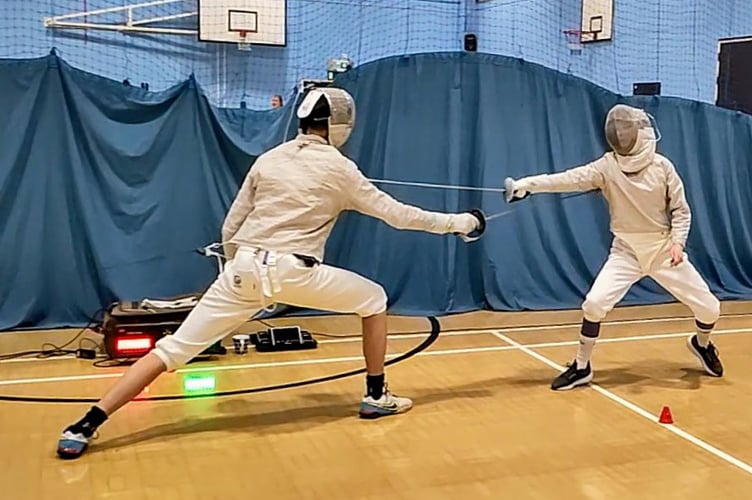 Heart of Devon Sabre fencers in action.