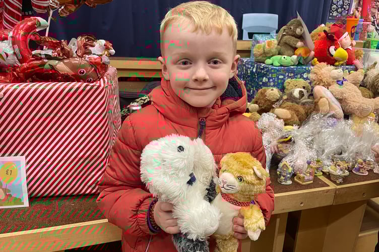 Daniel Lucas (6), with the teddy bears he won at Bow School's Christmas Fair.  AQ 1222
