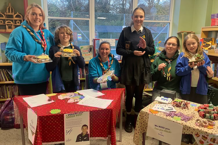 The 1st Bow Scouts sold Christmas decorations, mince pies and other items in aid of a forthcoming trip the Group intends to take to London in May.  The Group, comprising 30 Scouts and Leaders, intends to attend a Scout run facility and see a Show in May.  If you would like to make a donation towards the venture costs, please email: 1stBowScout@gmail.com .  AQ 1218
