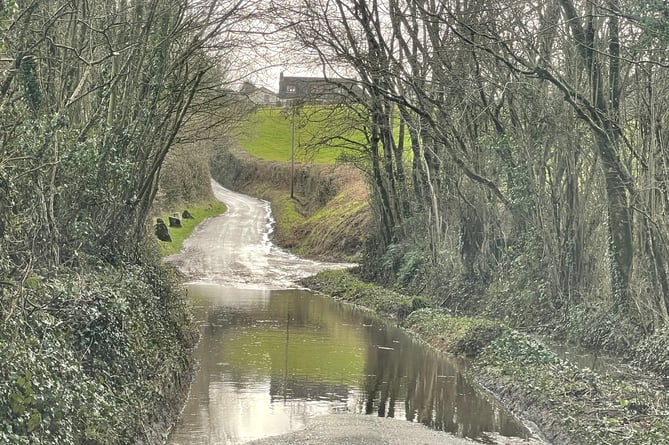 A flooded road near Coldridge. AQ 2875