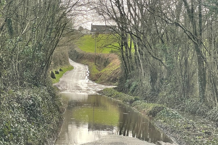 A flooded road near Coldridge.  AQ 2875