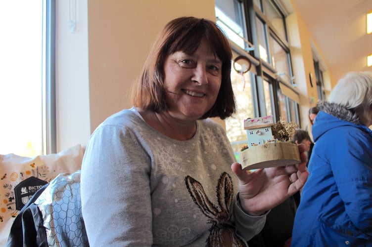 Mandy Brooks of Hittisleigh with one of her little cottages. SR 9295