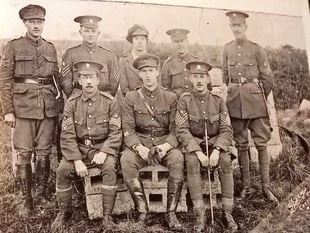 Who’s that in the back row of old Crediton photo?

