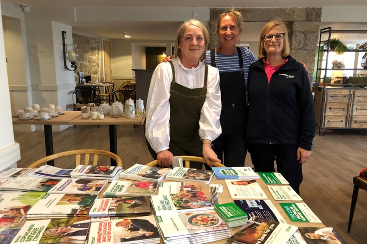 A recent Macmillan Cancer Café, showing some participants and the 'information stall’.